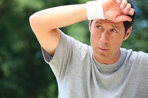 man wiping sweat resized 600