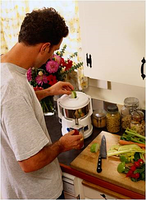 man using a juicer